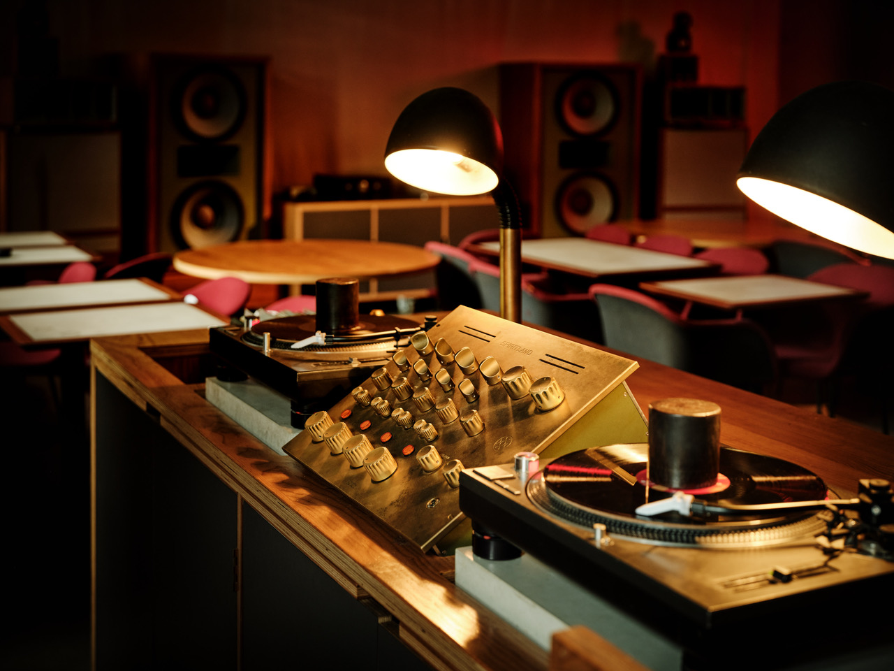 Spiritland, King's Cross — brass mixing desk, turntables and warm lighting
